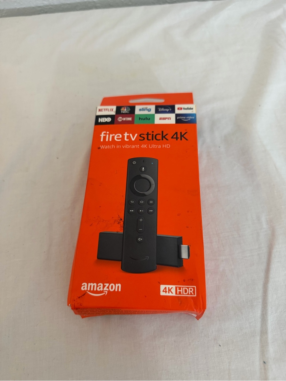 Amazon Fire TV Stick 4K in Orange with Black Remote